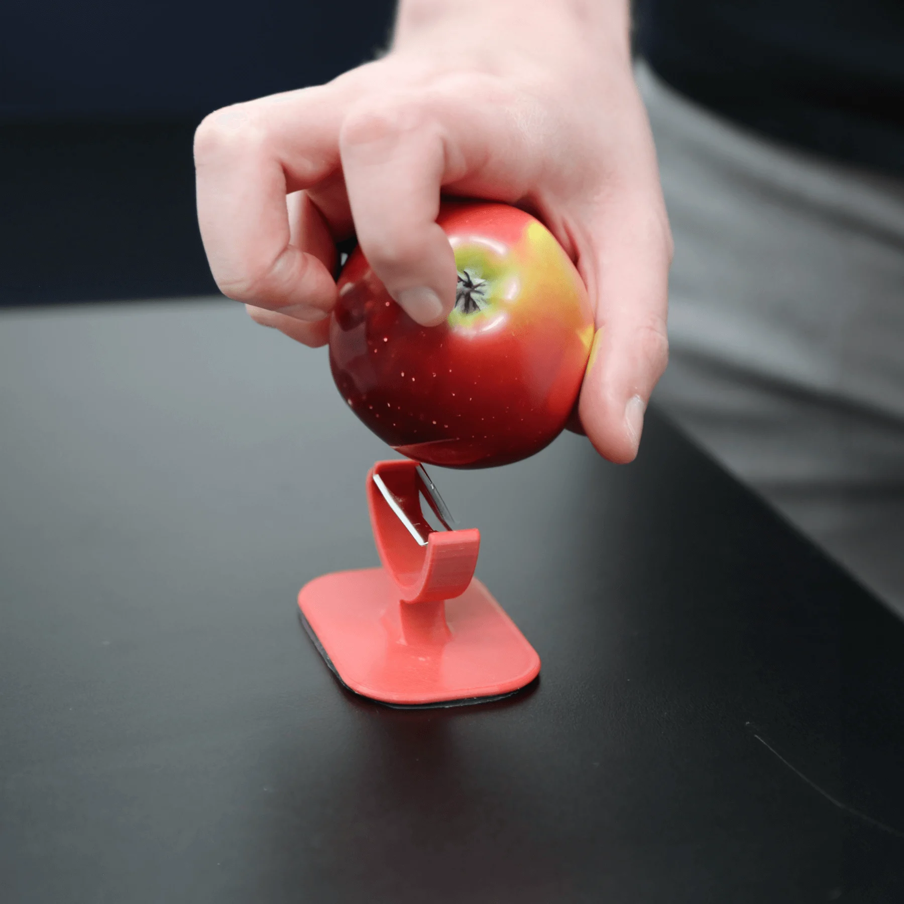 One handed veggie peeler peeling a apple