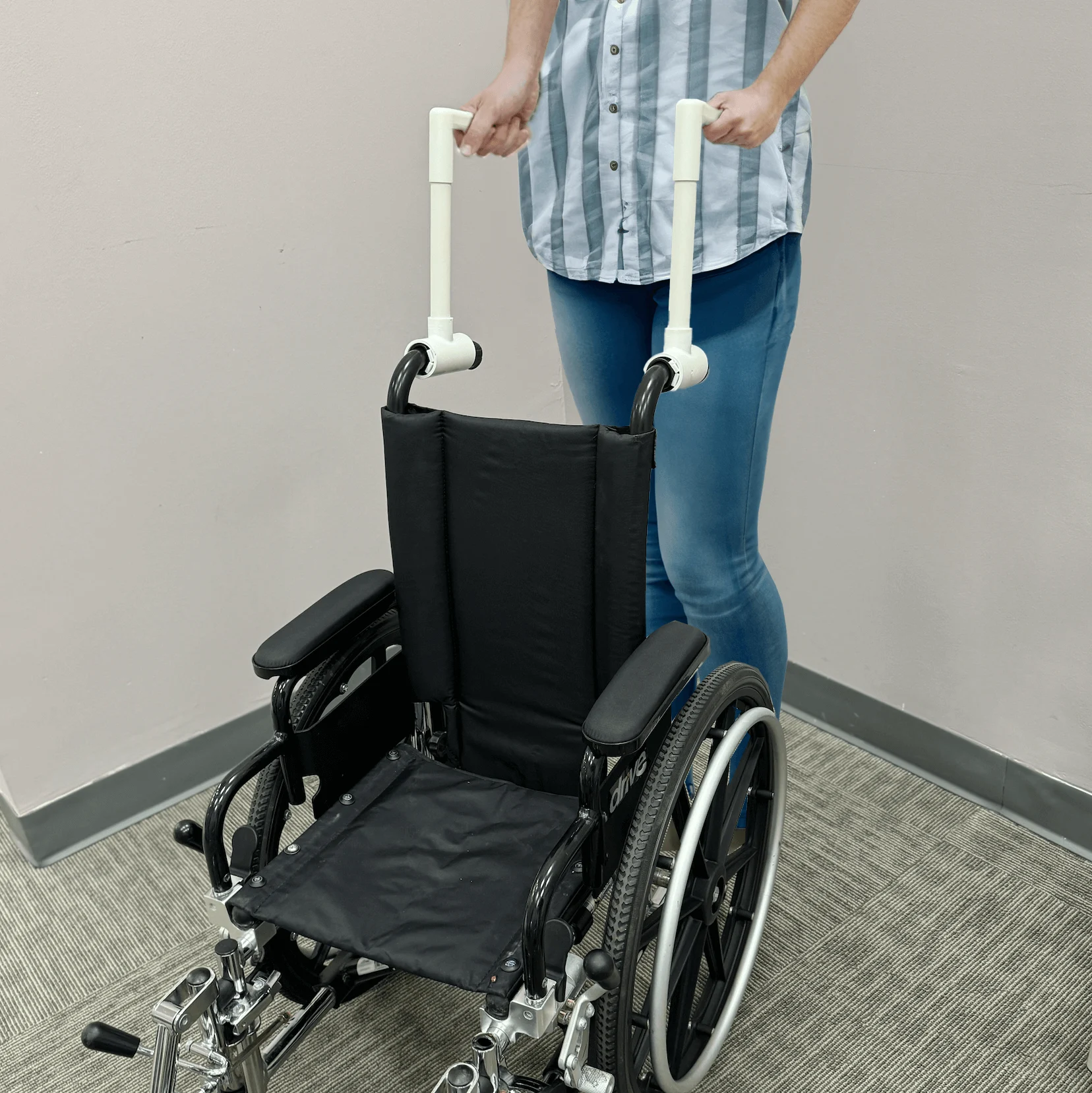 Wheelchair Handle extensions in use Wheelchair Handle extensions in use