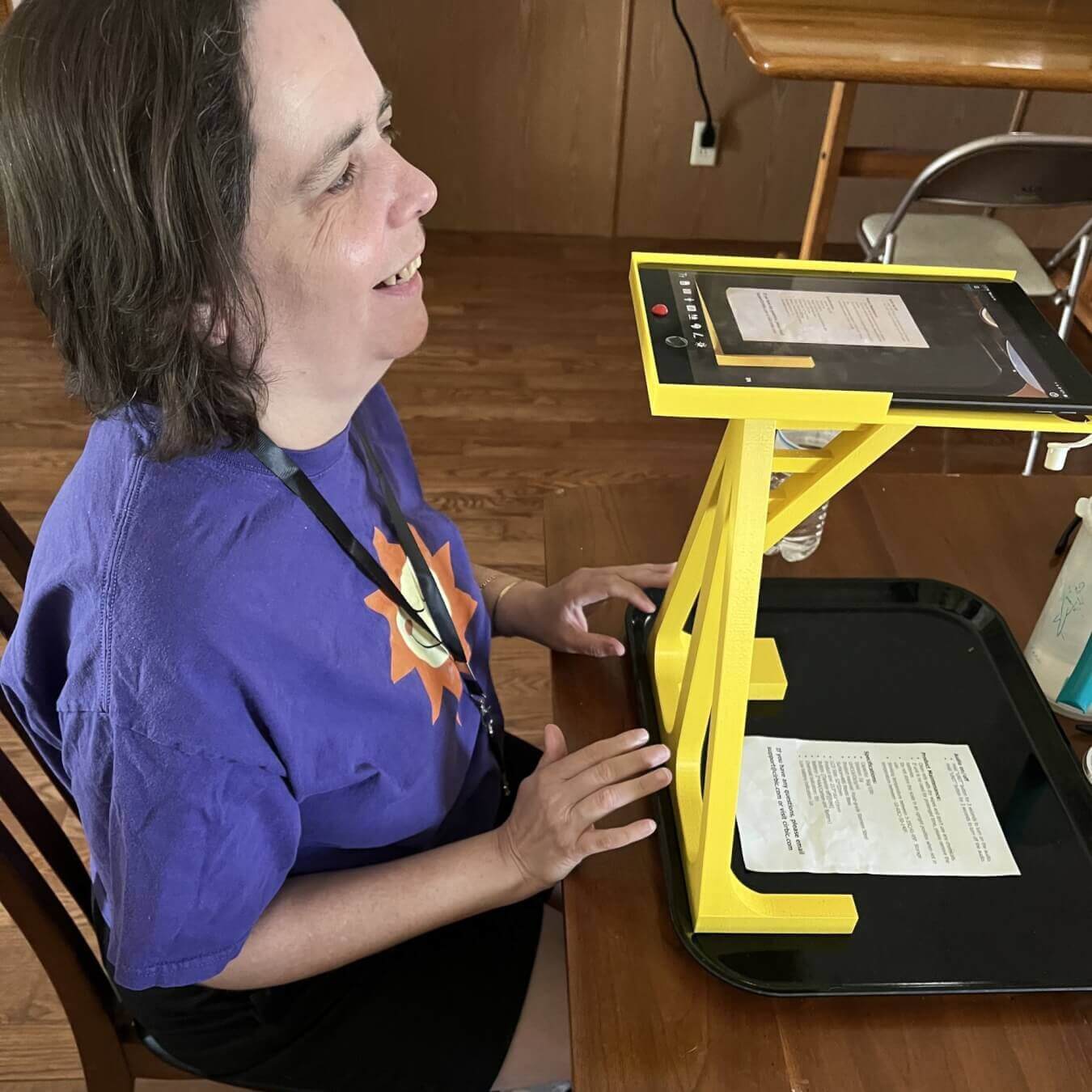 woman with visual impairment using 3d printed iPad stand for scanning documents scaled e1690914652948