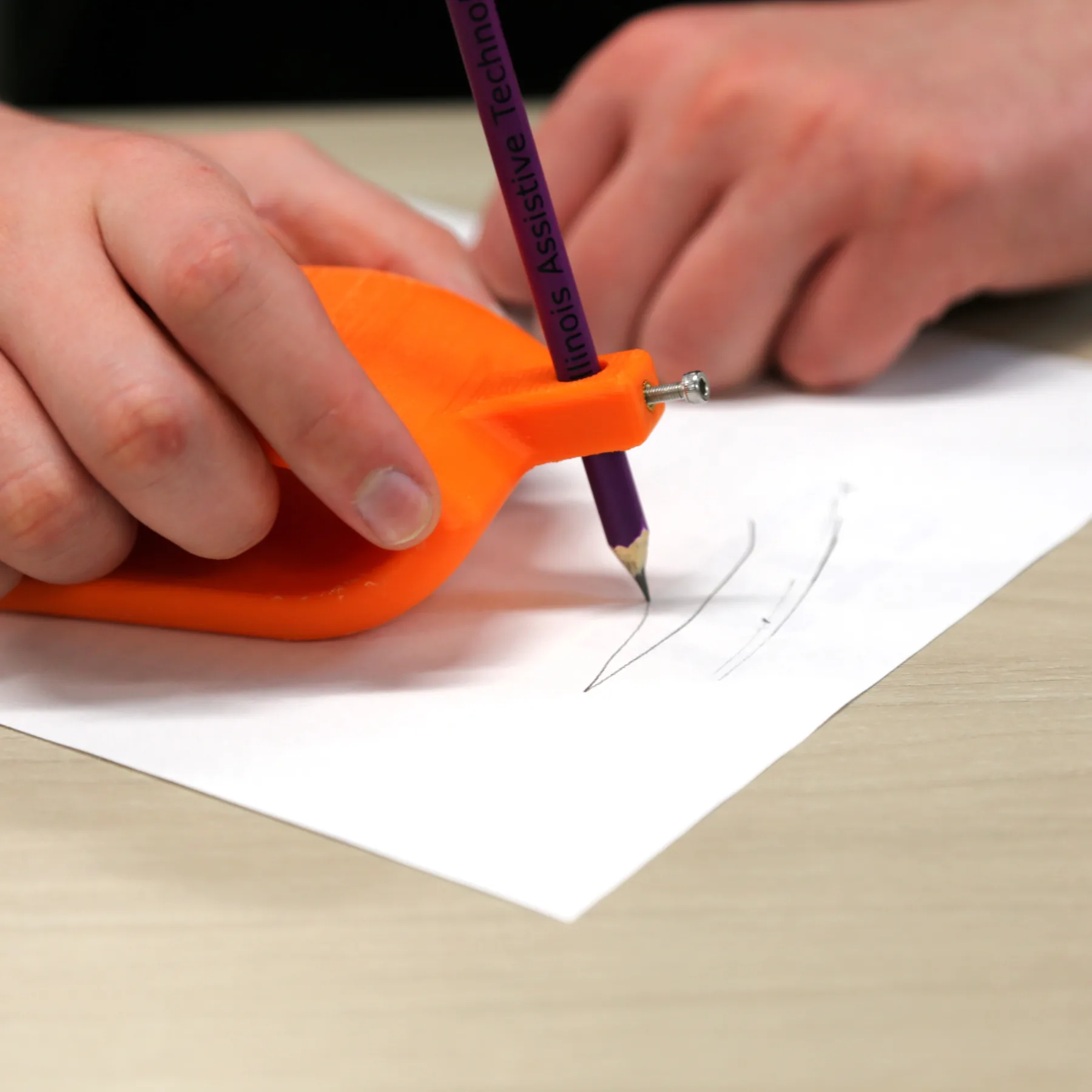 Man using Slanted writing aid