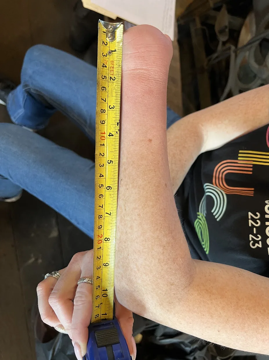 Arm with tape measure