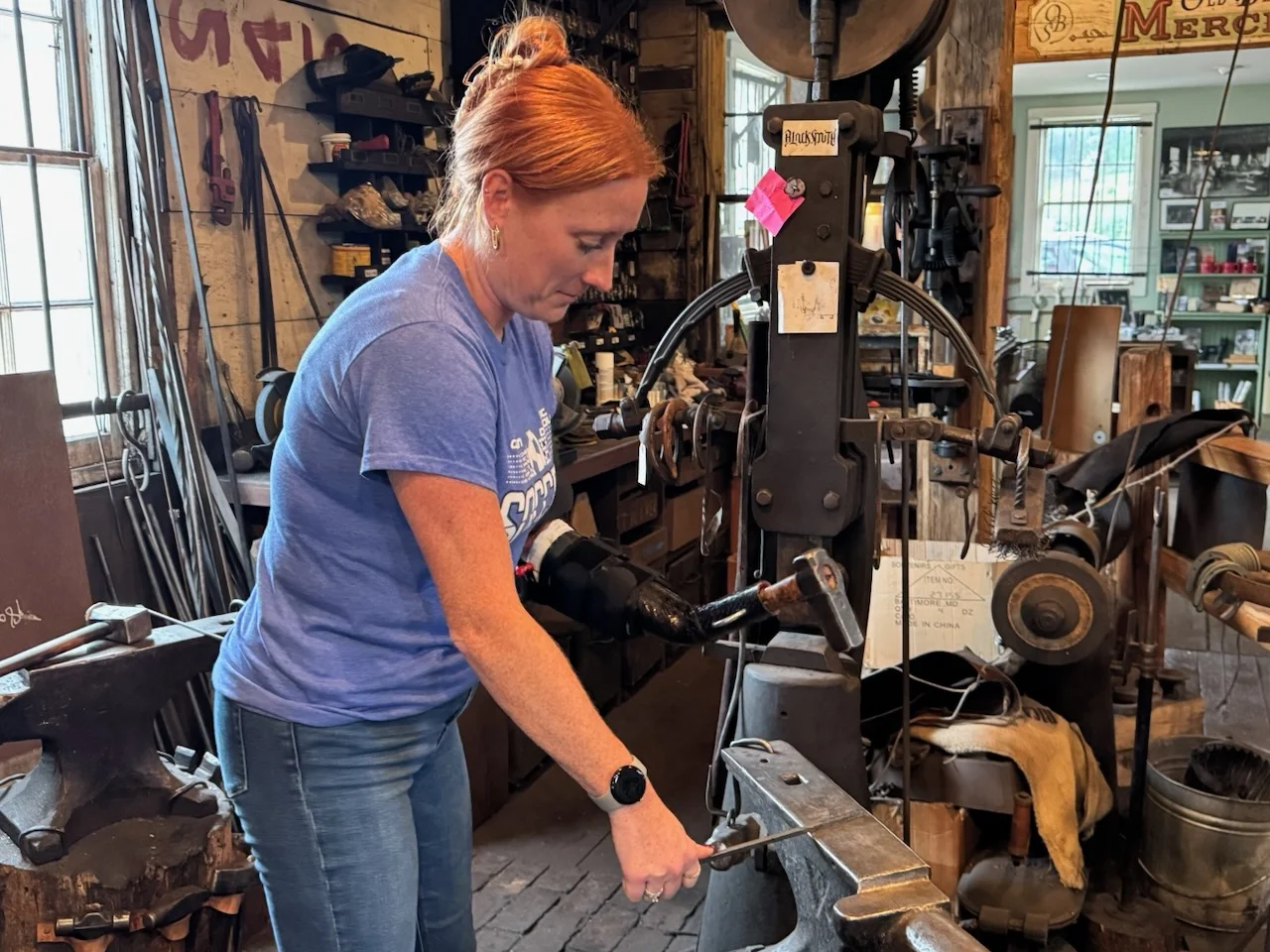 person using adaptive blacksmith tool