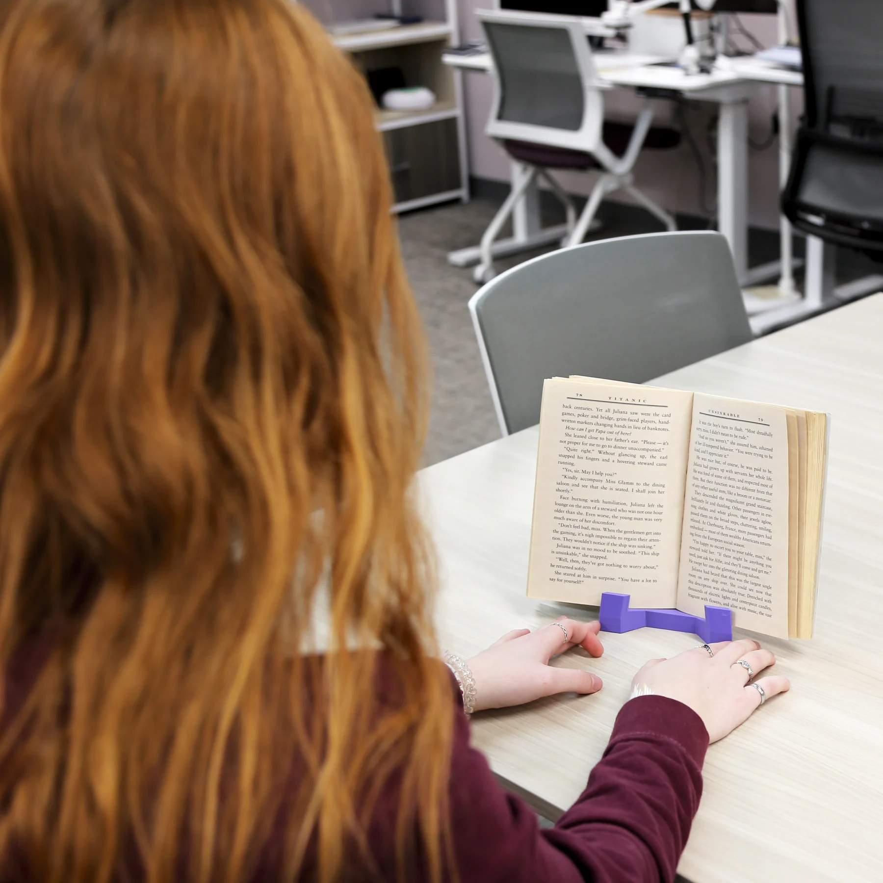 Woman reading using book stand