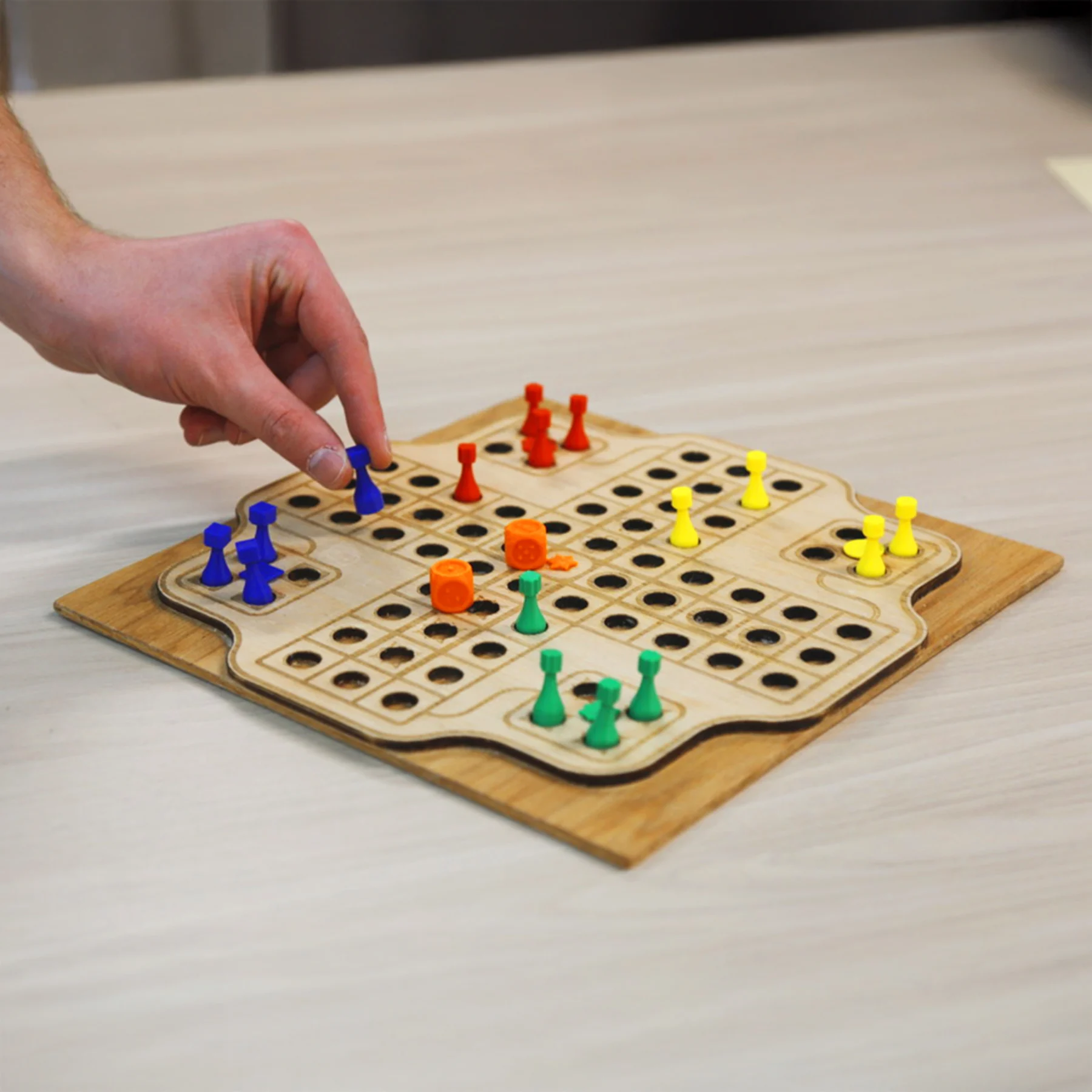 1.1 Parcheesi board in use