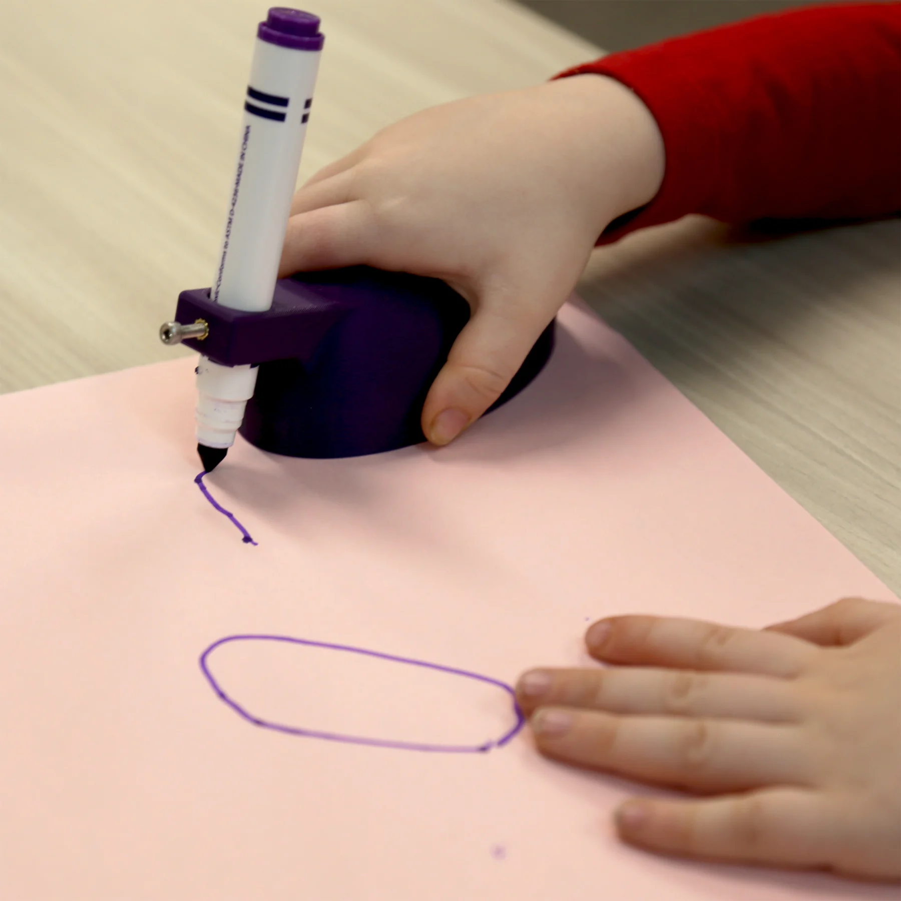 Child using writing aid