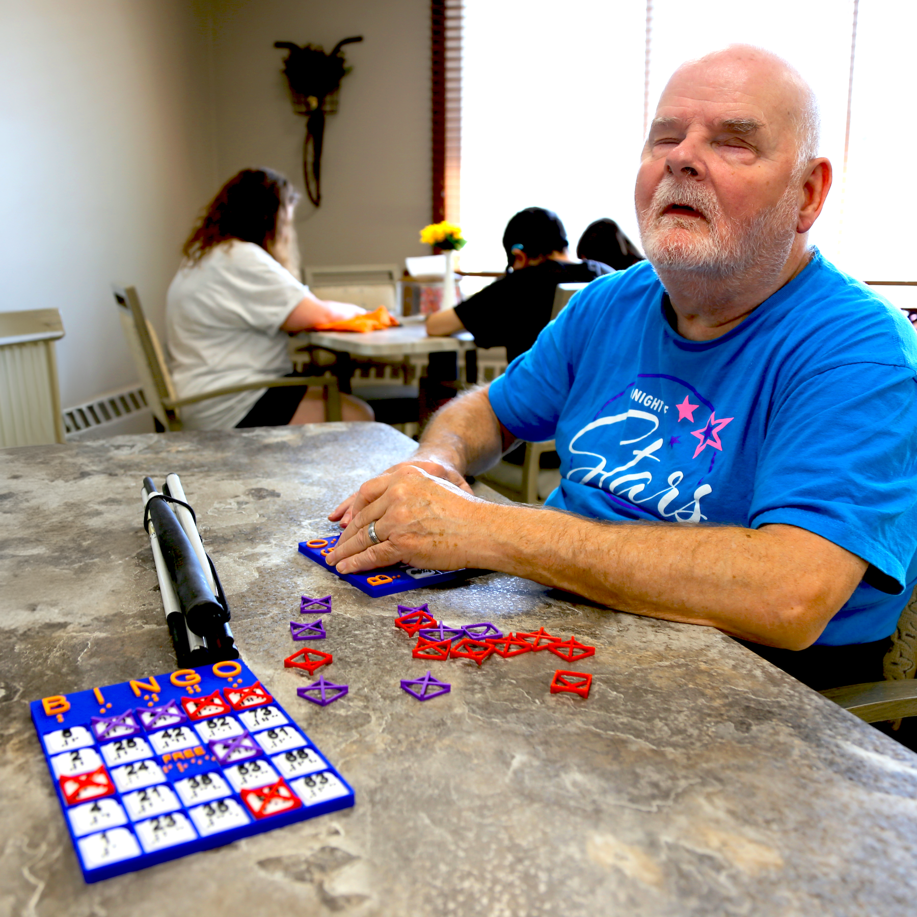 Man using a braille bingo card