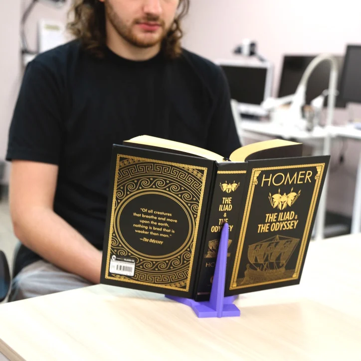 Man using book stand to read his book