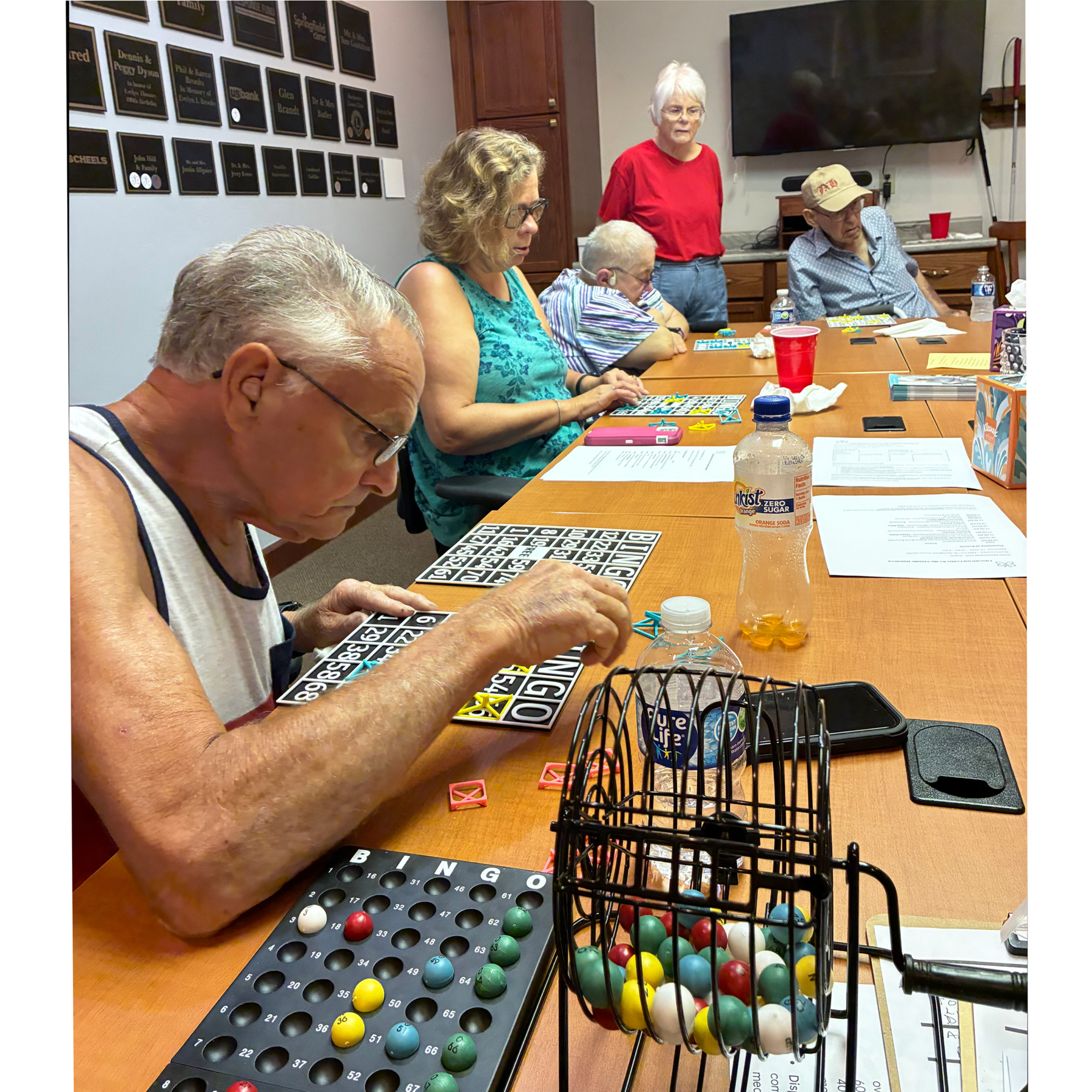 Group using braille raised lettered bingo boards Group using braille raised lettered bingo boards
