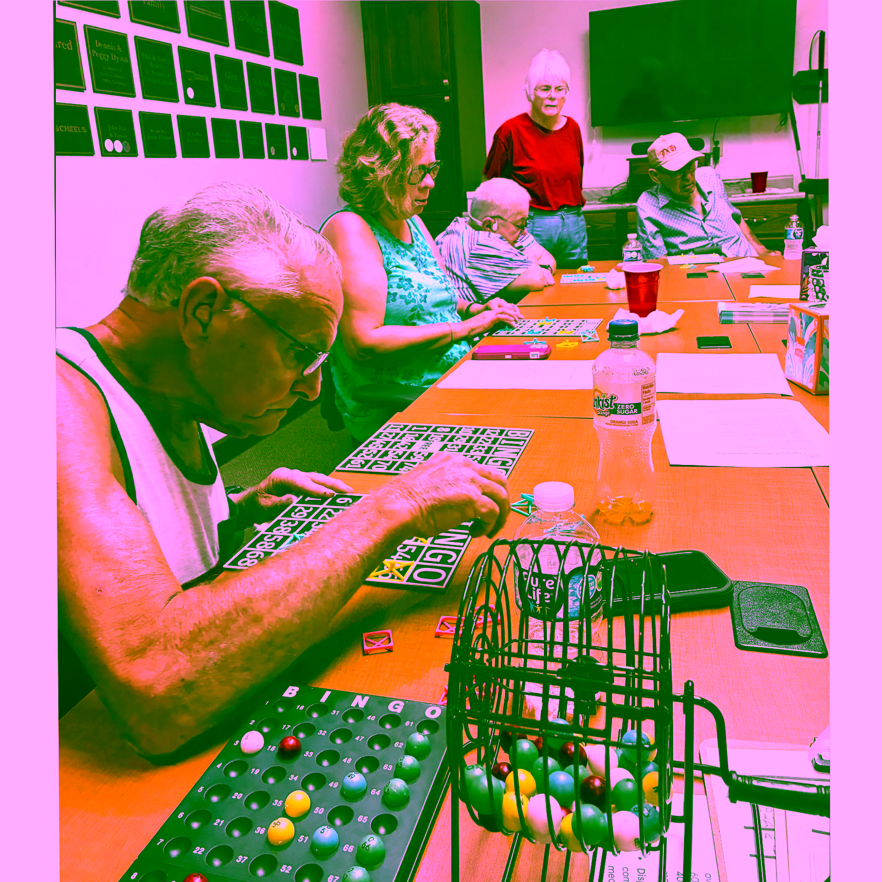 Group using braille raised lettered bingo boards