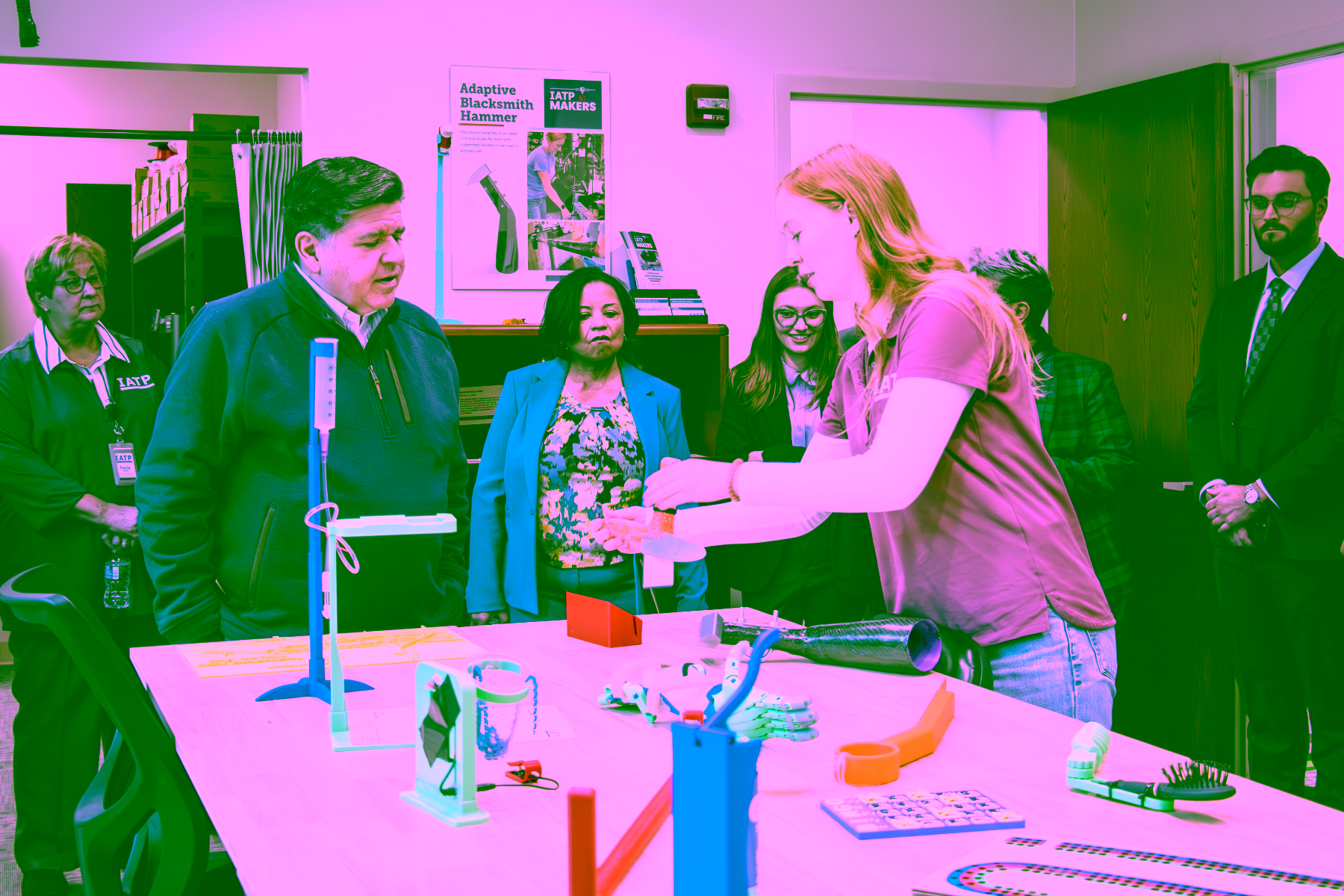 IATP Maker staff showing Governor Pritzker custom fabricated assistive technology
