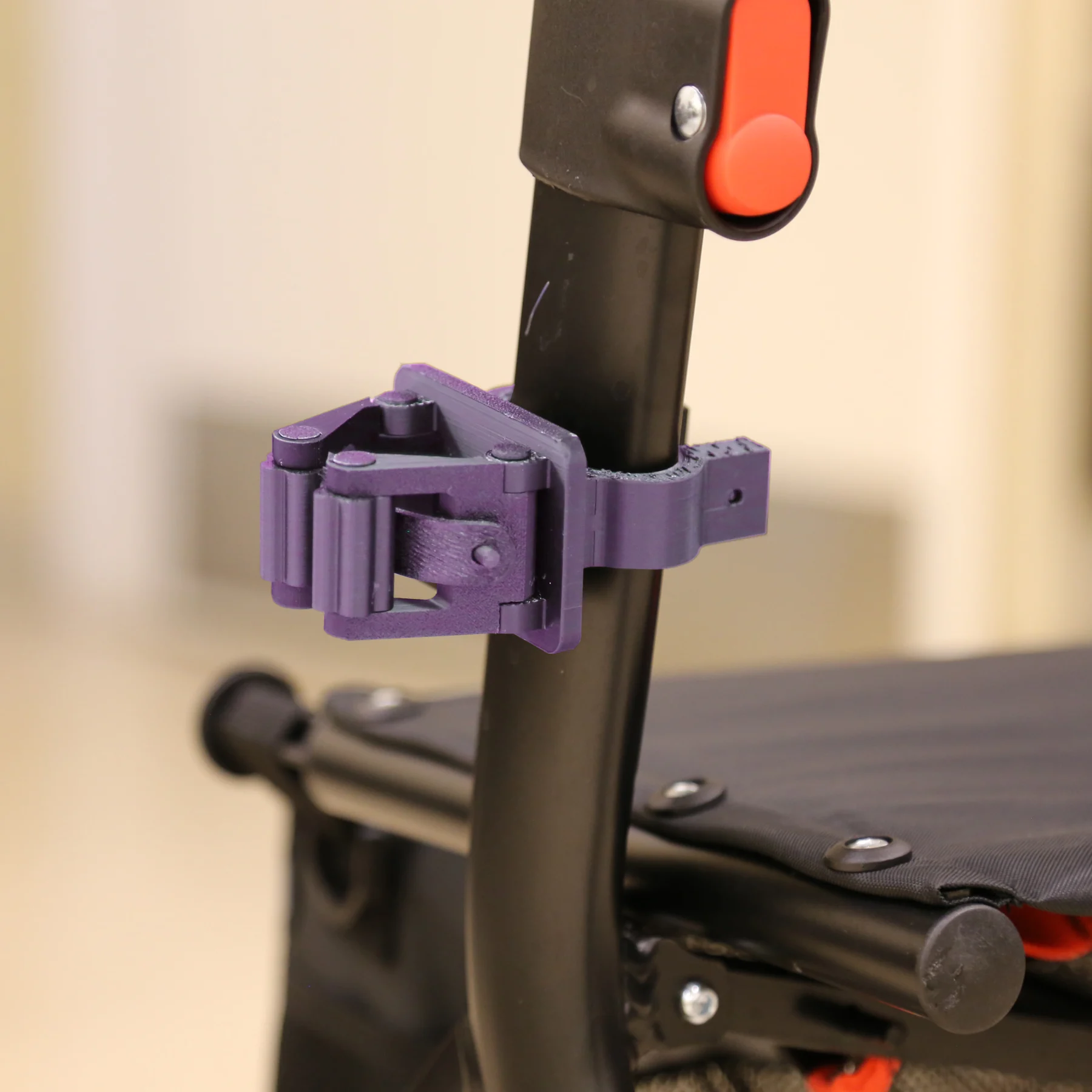 Cane holder for rollator mounted on rollator close up