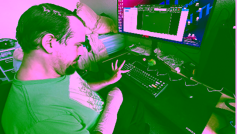 Alex using his keyguard to operate his computer