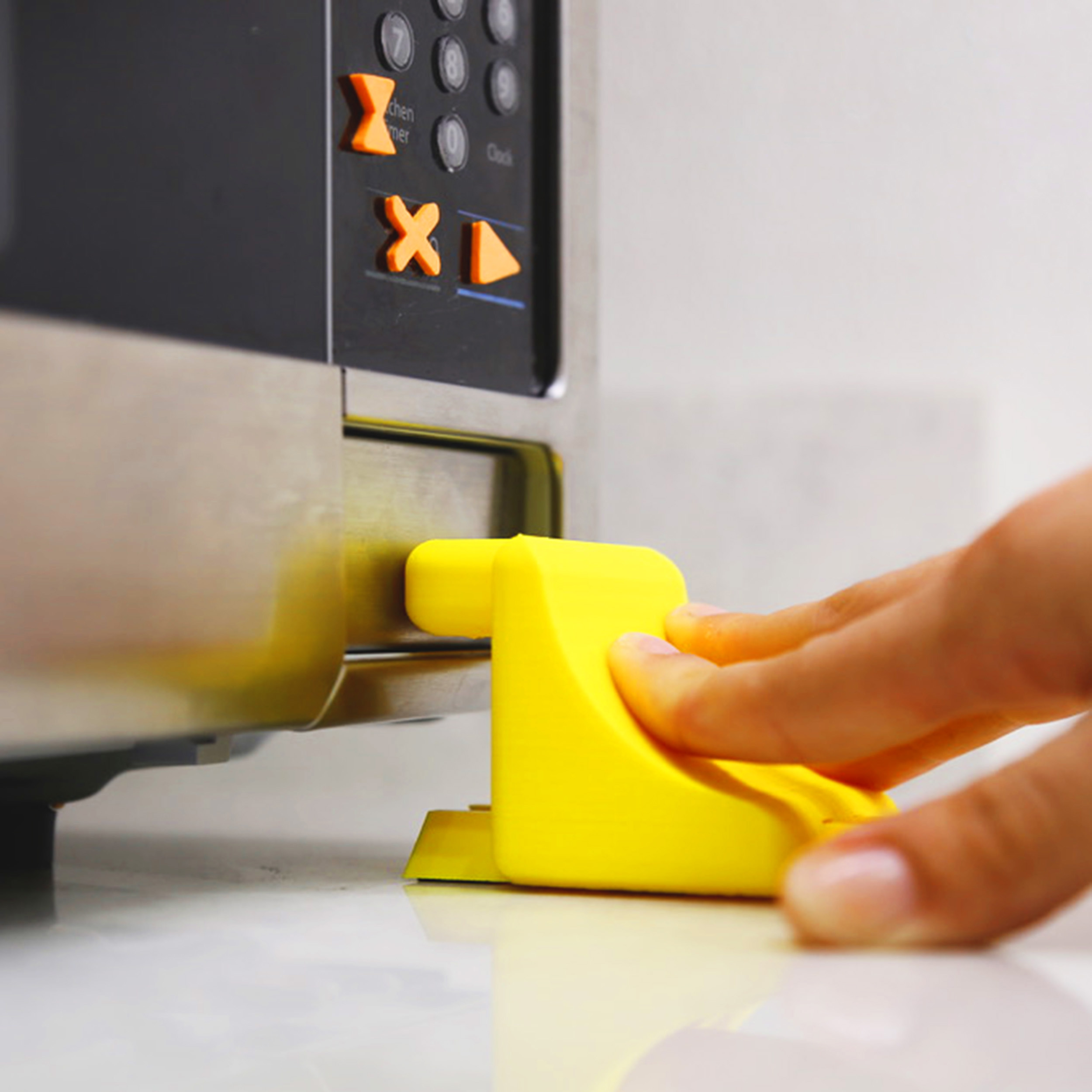 Microwave Door Opener in use Microwave Door Opener in use