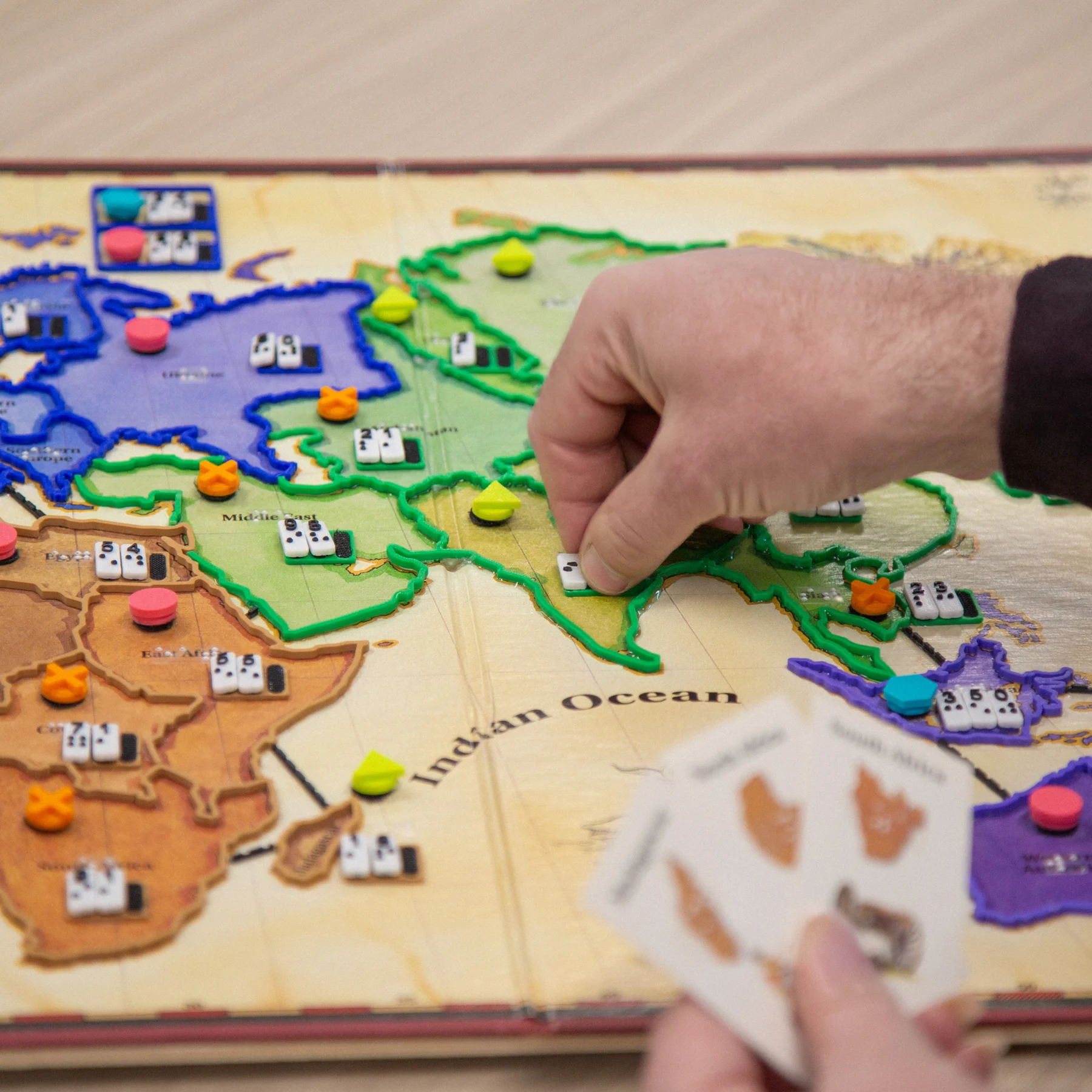 Adapted Risk man picking up game pieces